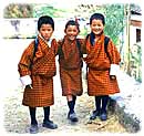 Schoolboys in Bhutan wear traditional clothing