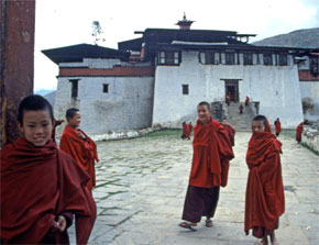 A group of young monks greet visitors at a monastery in Bhutan.