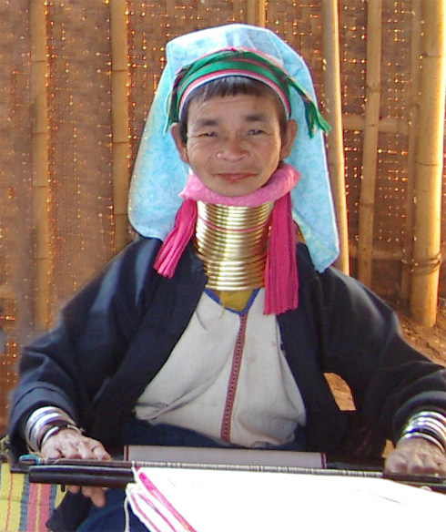 A lady of the Long Neck Padaung tribe displays the neck rings she has worn since her youth.