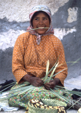 A Young Tarahumara Lady Weaves a Basket