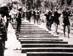 Prisoners build Bridge on the River Kwai.