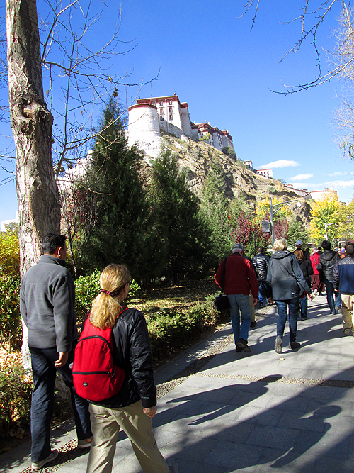 Ellen Klein walks among a group in the beautiful palace grounds. 