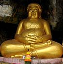 Fat Buddha in cave on Mekong River in Laos
